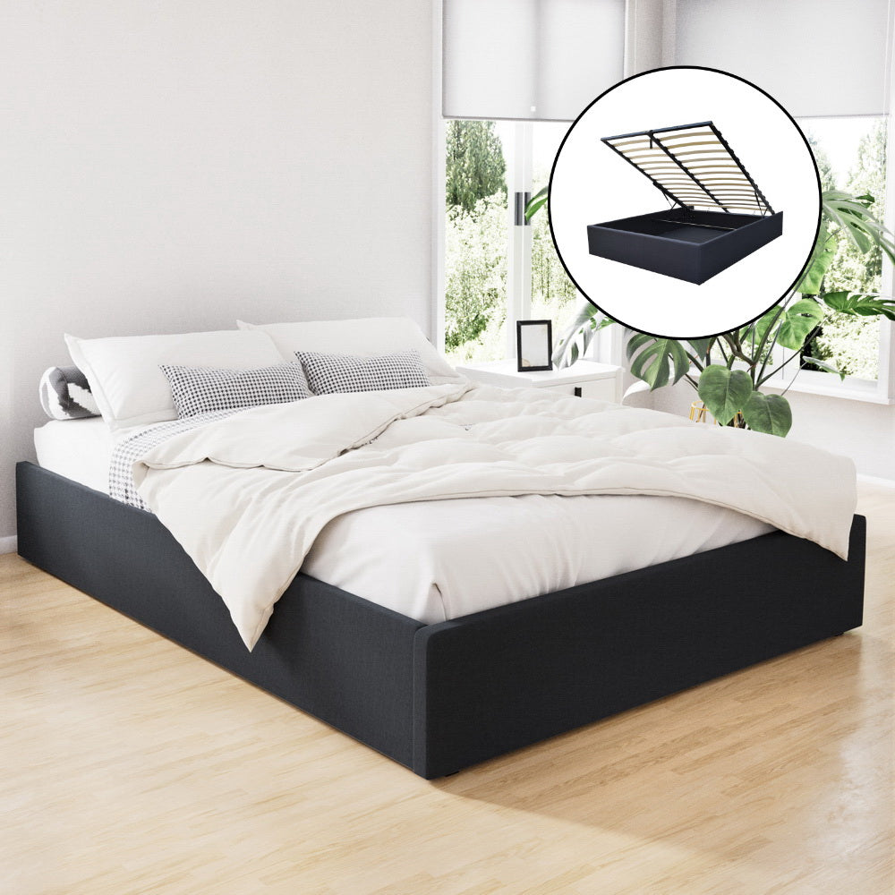 Toki Gas Lift Queen Bed Frame Base with Storage Charcoal, upholstered, shown in bedroom with bedding and gas lift storage feature inset.
