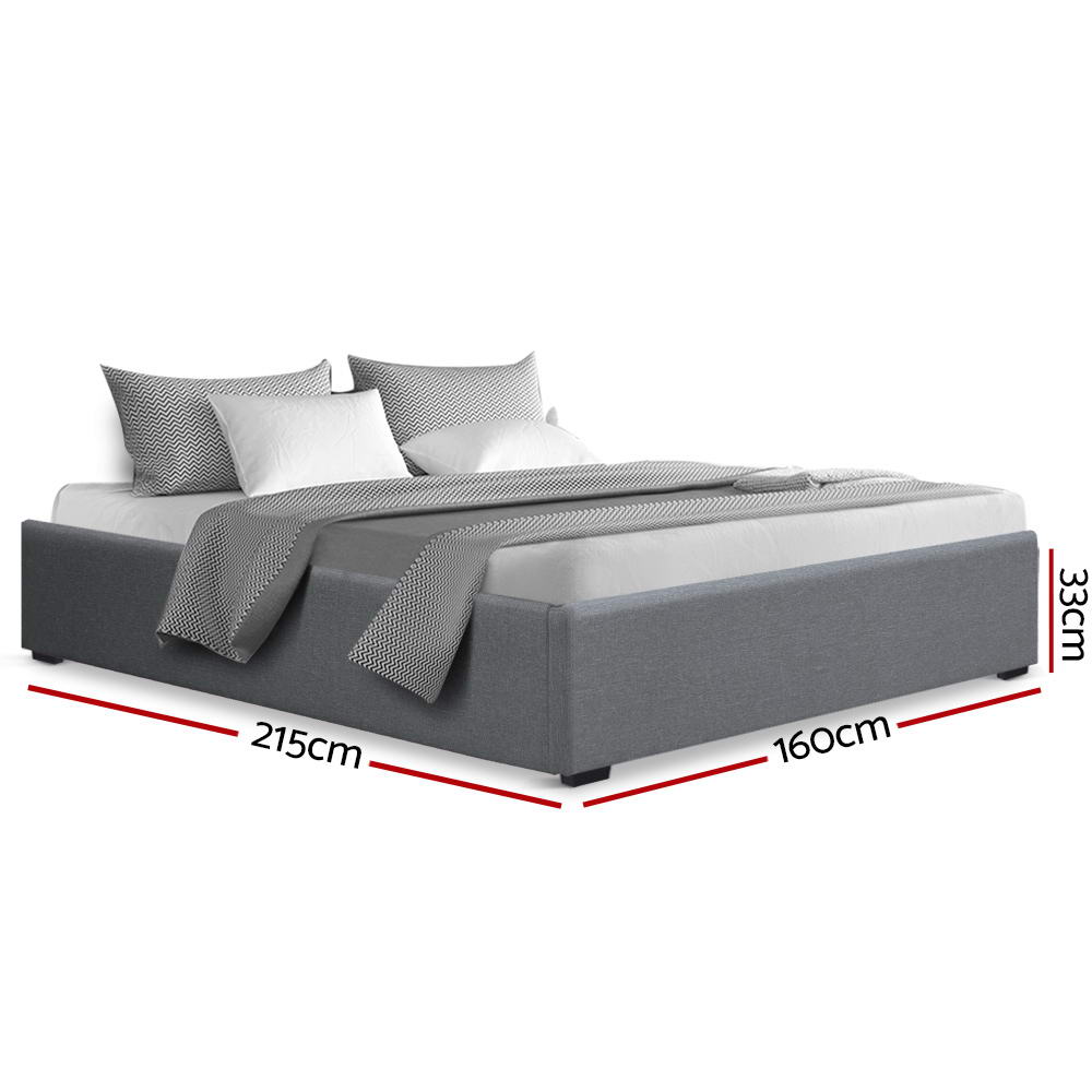 Toki Gas Lift Queen Bed Frame Base with Storage Grey, upholstered grey fabric, with pillows and bedding on white background