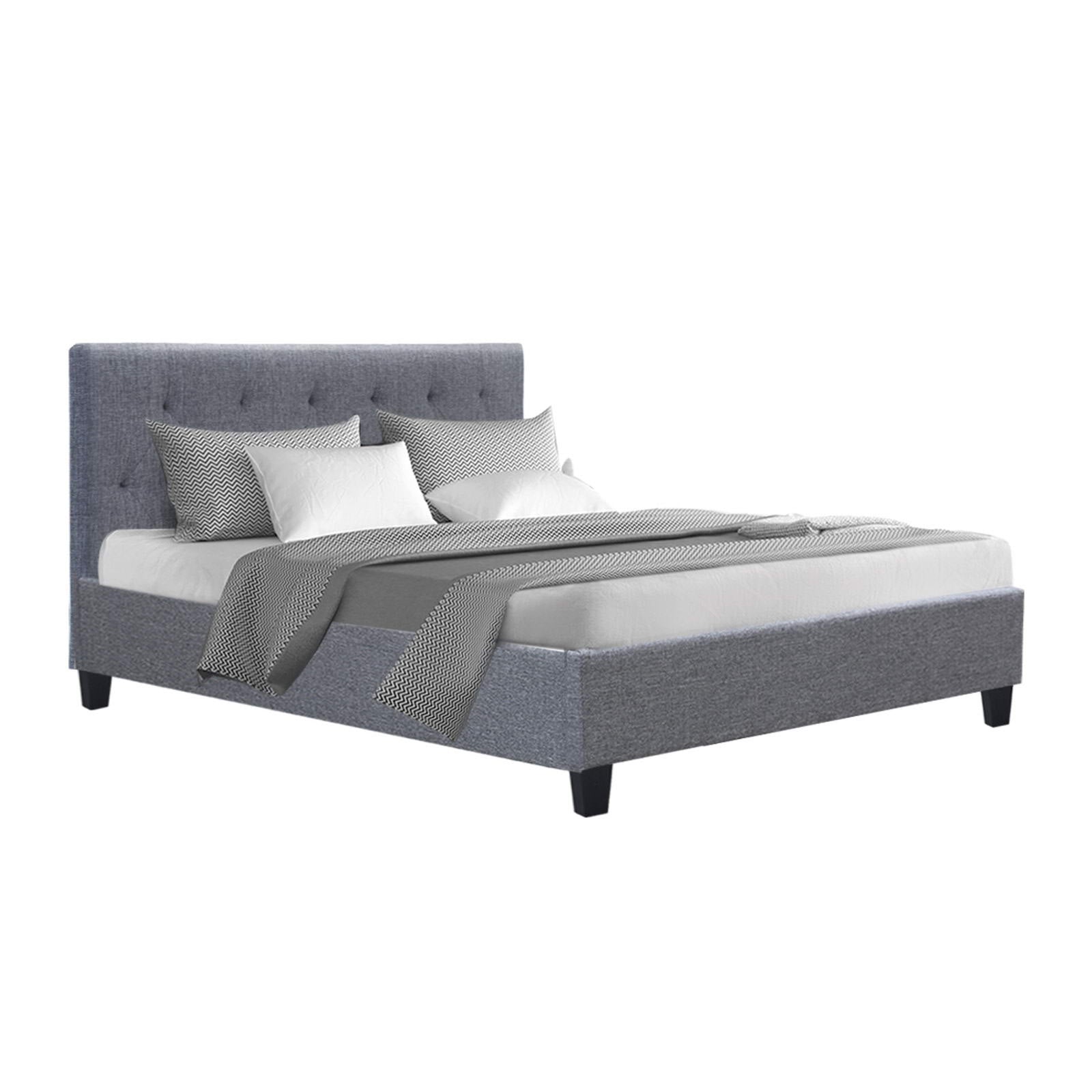 Hyams Double Bed Frame Grey with tufted headboard, upholstered in grey fabric, shown with mattress and bedding accessories