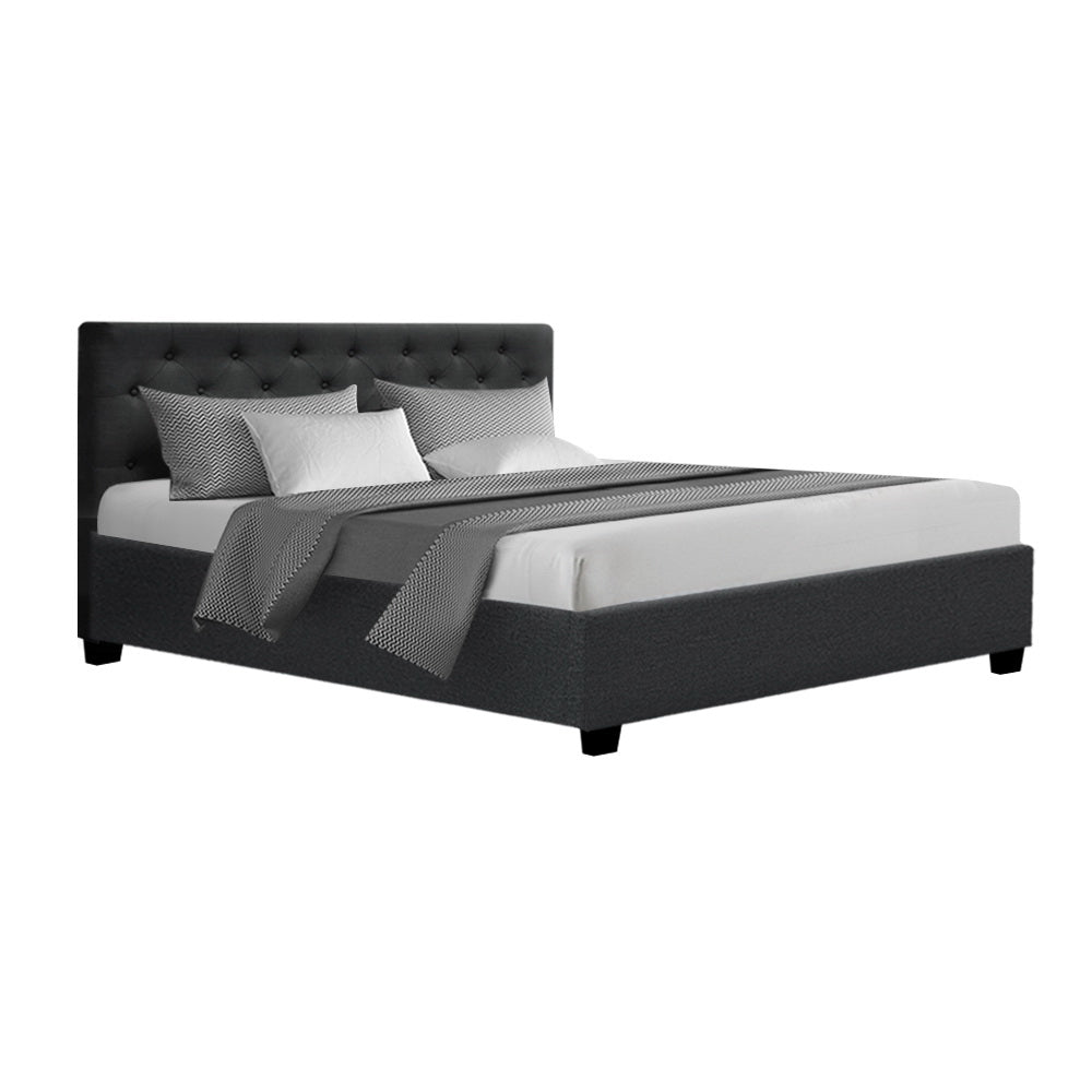 Dorilla Gas Lift Storage Queen Bed Frame - Charcoal with upholstered tufted headboard and low-profile base in bedroom setting