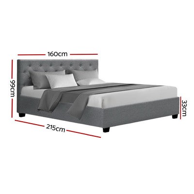 Dorilla Gas Lift Storage Queen Bed Frame - Grey with tufted headboard, storage feature, and grey upholstery in bedroom setting