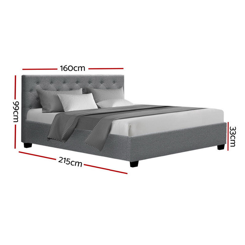 Dorilla Gas Lift Storage Queen Bed Frame - Grey with tufted headboard, storage feature, and grey upholstery in bedroom setting