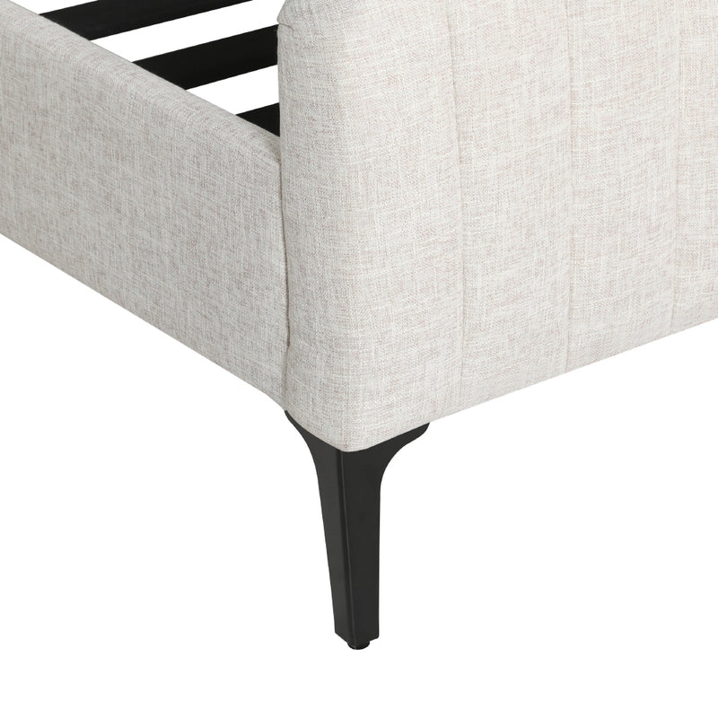 Close-up of Burleigh King Bed Frame Beige corner showing textured faux linen upholstery and black tapered leg on white background