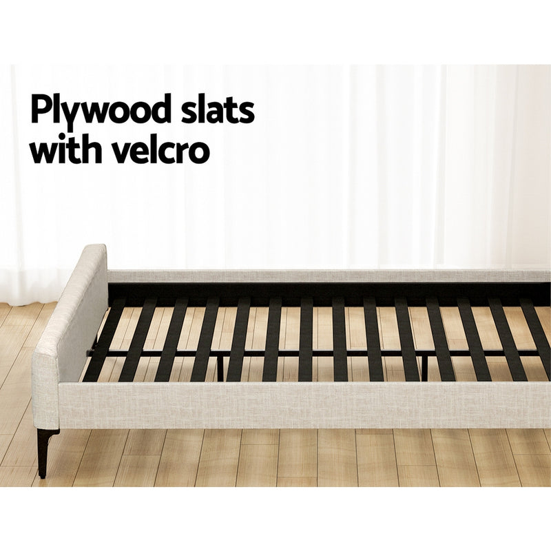 Burleigh King Bed Frame Beige showing plywood slats with velcro and beige upholstered frame on wooden floor