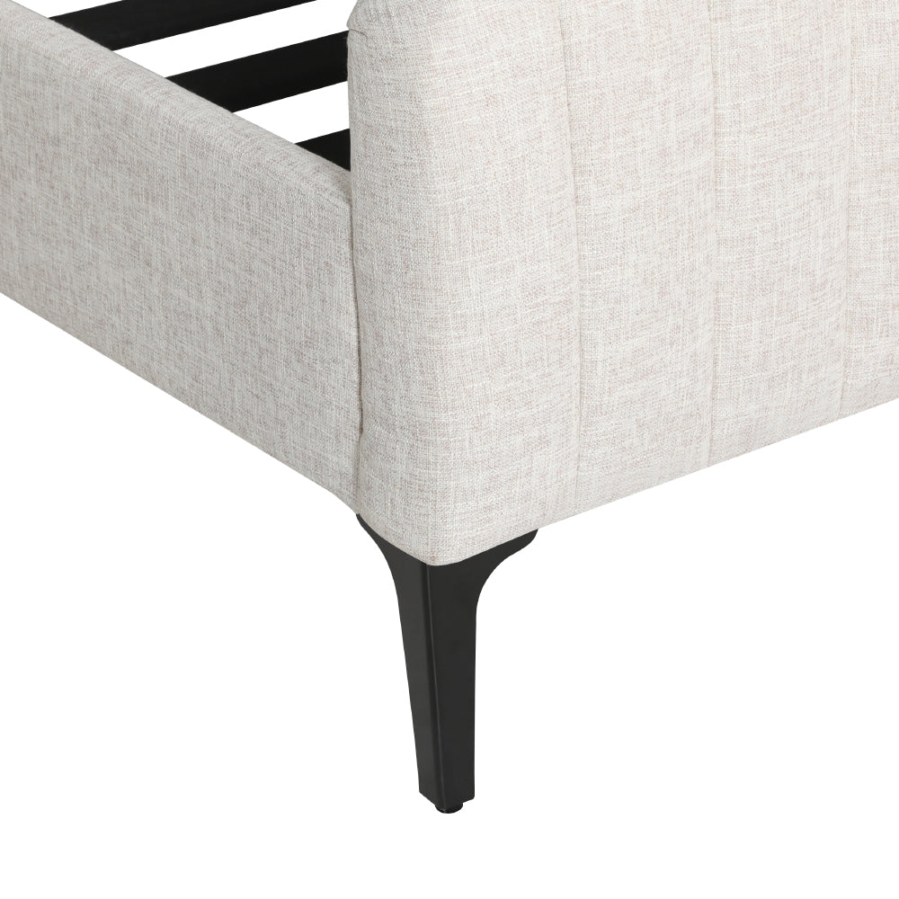Close-up of Burleigh Queen Bed Frame Beige corner with textured fabric upholstery and black tapered legs.