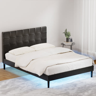 Manly Double LED Bed Frame With Charge Ports Black in bedroom setting with tufted headboard and blue LED lighting beneath.