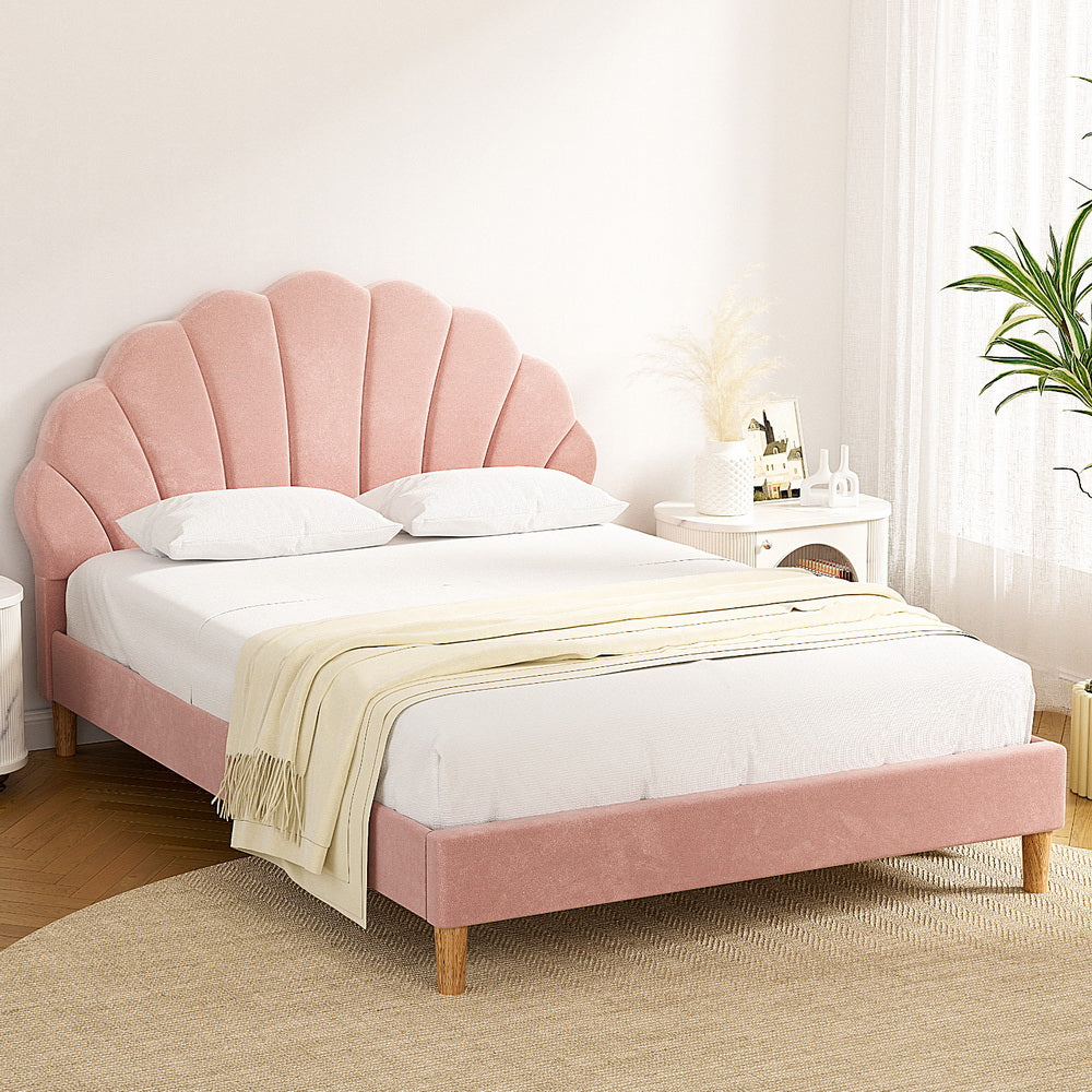Rosie Double Bed Frame - Pink Velvet with scalloped headboard, wooden legs, and soft upholstery in bright bedroom setting