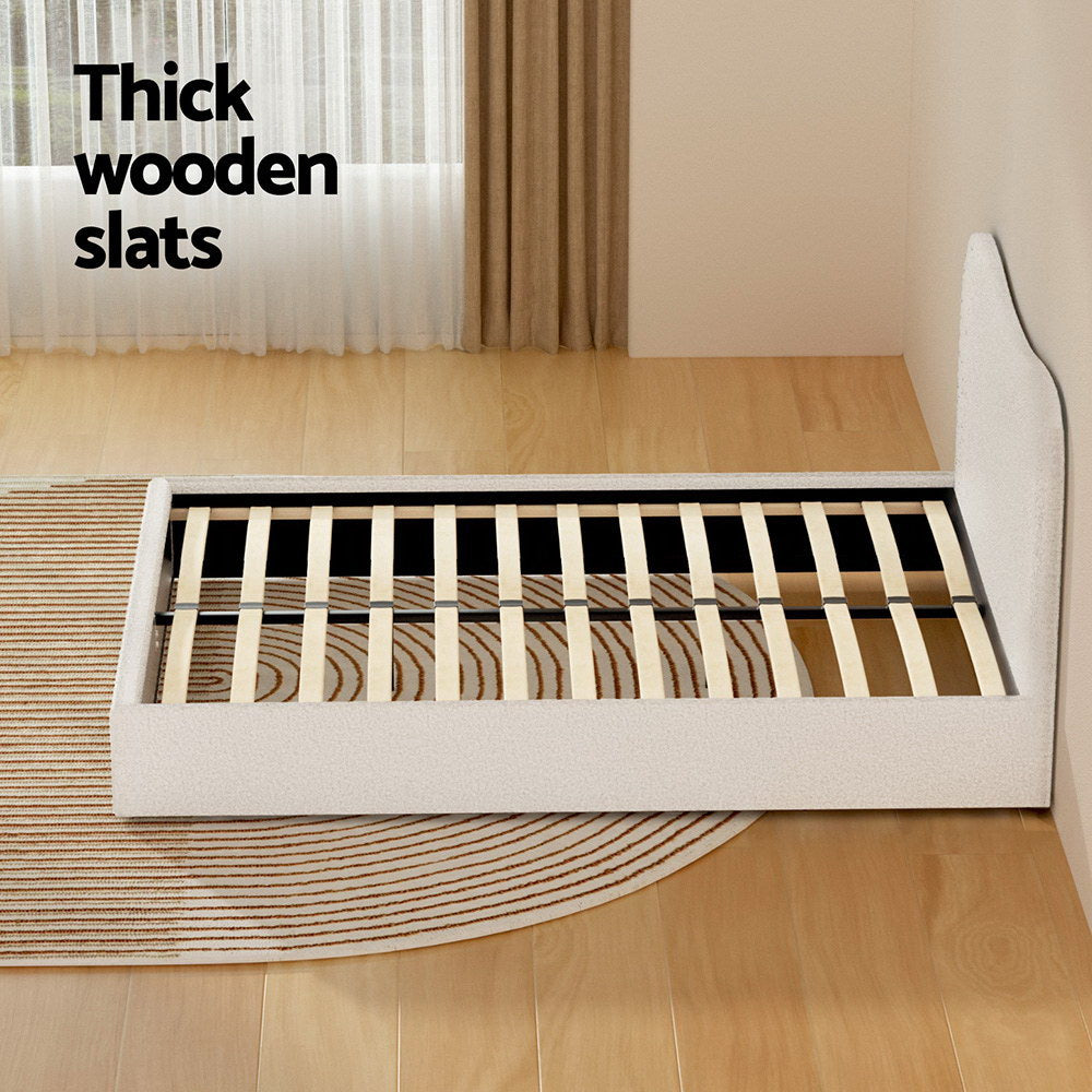 Albany Double Boucle Bed Frame - Cream White with thick wooden slats and upholstered boucle fabric frame on light wood flooring