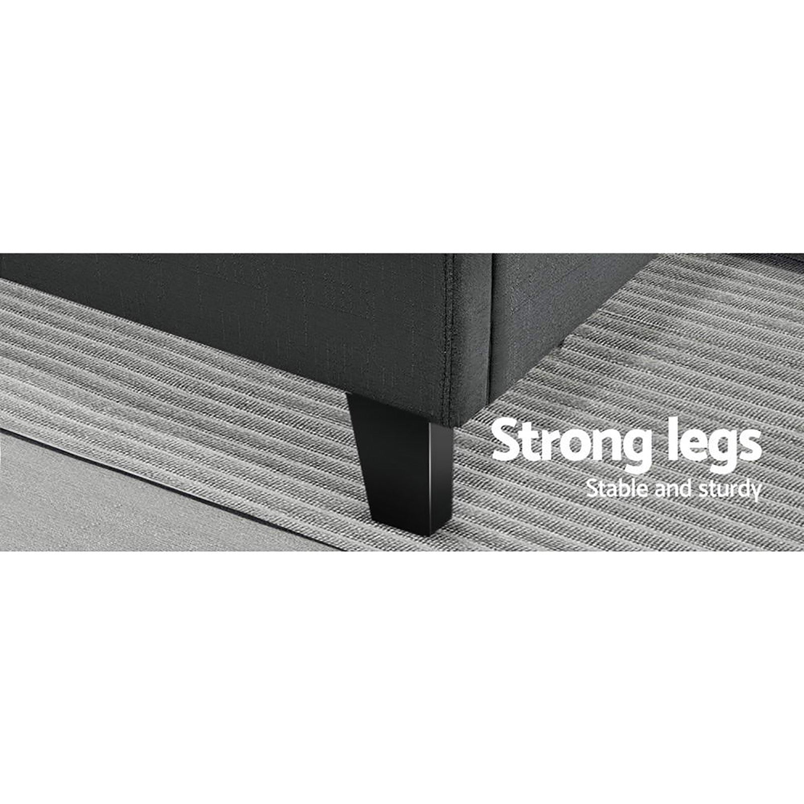 Close-up of strong legs on Bondi Queen Bed Frame Charcoal, showing sturdy design and charcoal upholstery on a textured rug.