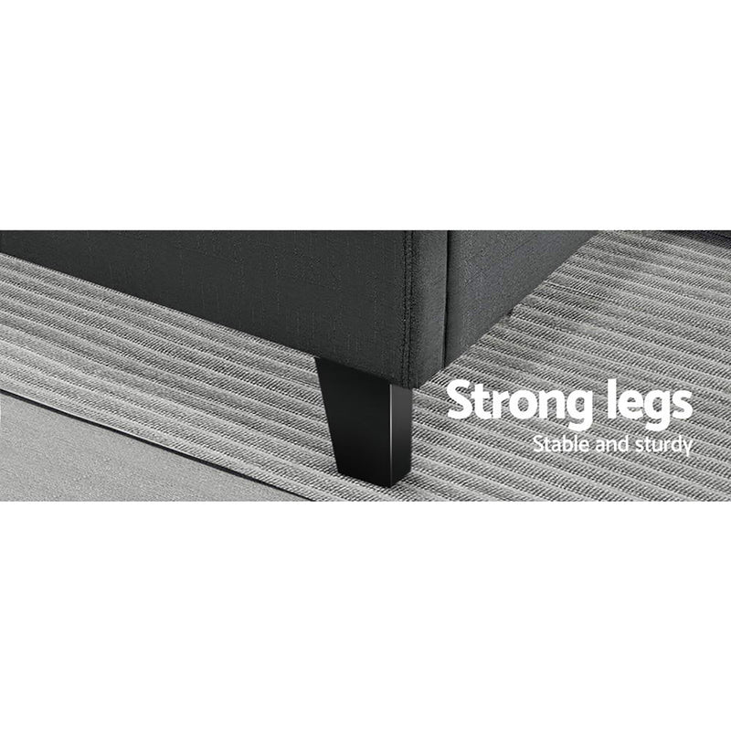 Close-up of strong legs on Bondi Queen Bed Frame Charcoal, showing sturdy design and charcoal upholstery on a textured rug.