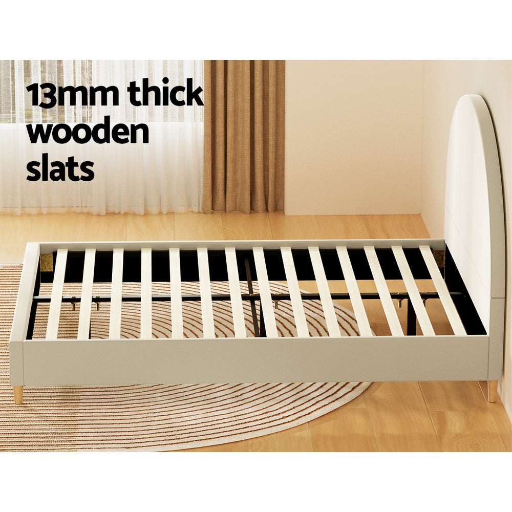 Ella Arched Queen Bed Frame Cream Velvet with thick wooden slats on light wood floor and neutral curtains background