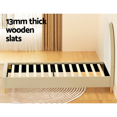 Ella Arched Single Bed Frame Cream Velvet with 13mm thick wooden slats on light wood flooring in bedroom setting