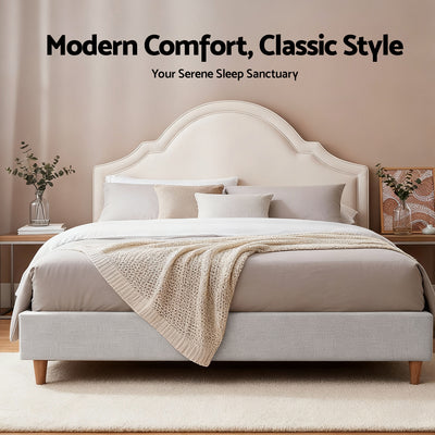 Iris Queen Bed with Scalloped Velvet Headboard – Beige in bedroom setting with neutral bedding and wooden legs