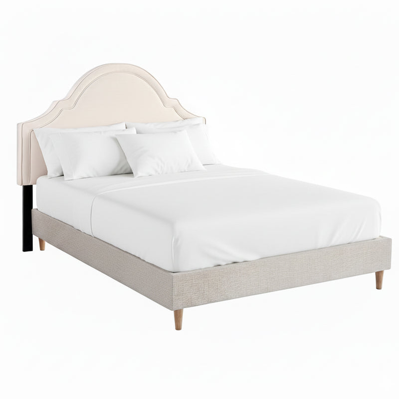 Iris Queen Bed with Scalloped Velvet Headboard – Beige with soft curved design and wooden legs, styled with white bedding