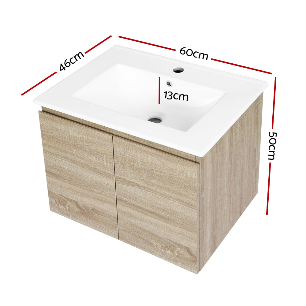 Vanity Unit 600mm with Basin Oak featuring a white basin and oak wood cabinet with two doors and measured dimensions.