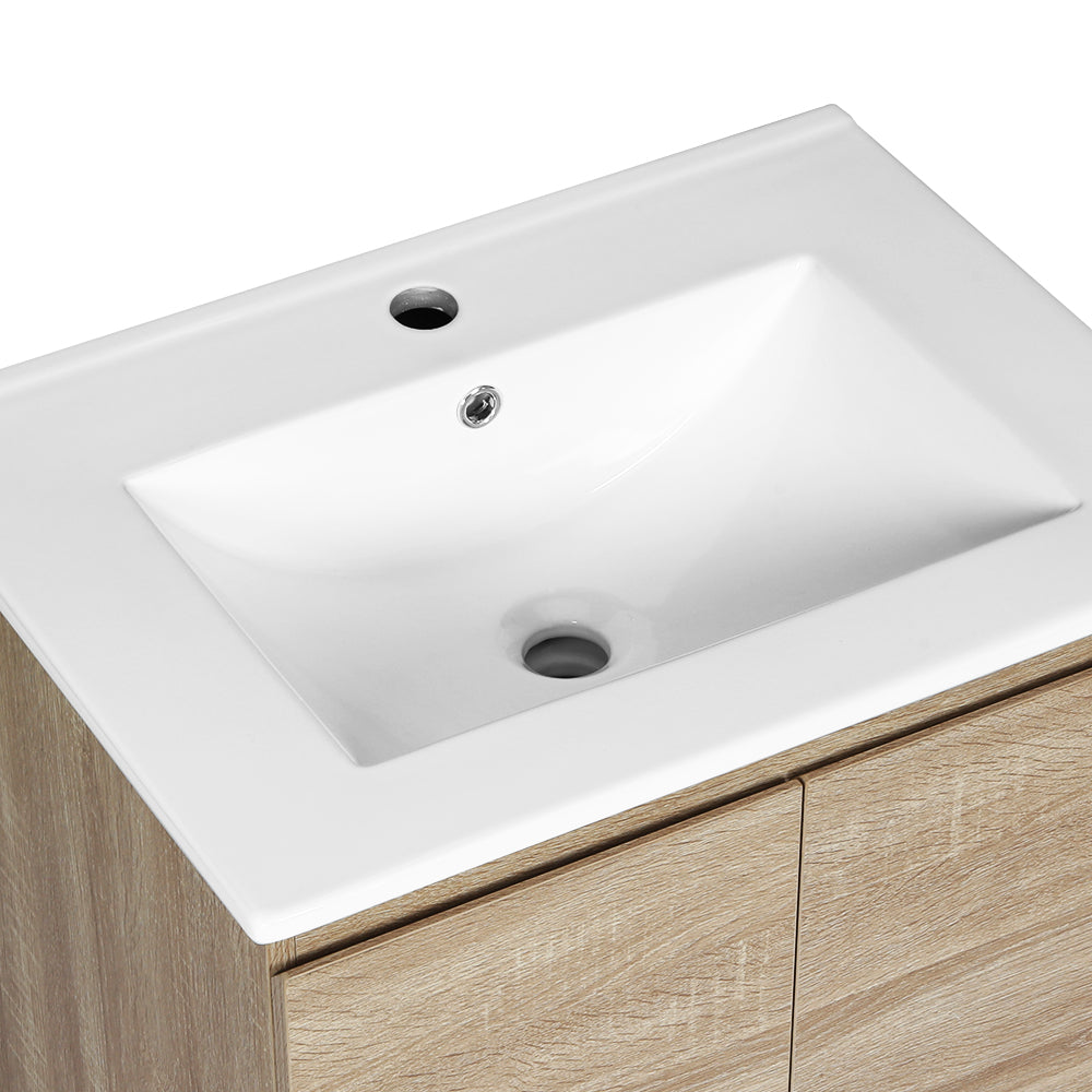 Vanity Unit 600mm with Basin Oak featuring white rectangular basin and light oak cabinet with two doors on white background