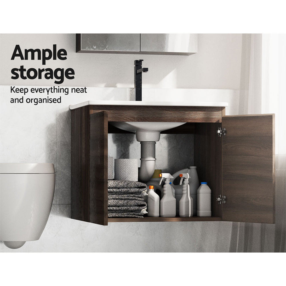 Vanity Unit 600mm with Basin Walnut featuring open doors revealing ample storage with towels and cleaning bottles inside