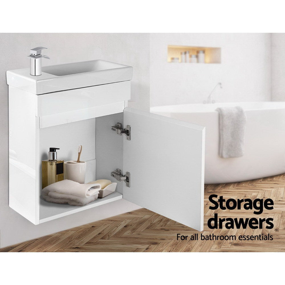 Vanity Unit 400mm with Basin White bathroom cabinet with open door showing storage space and modern faucet