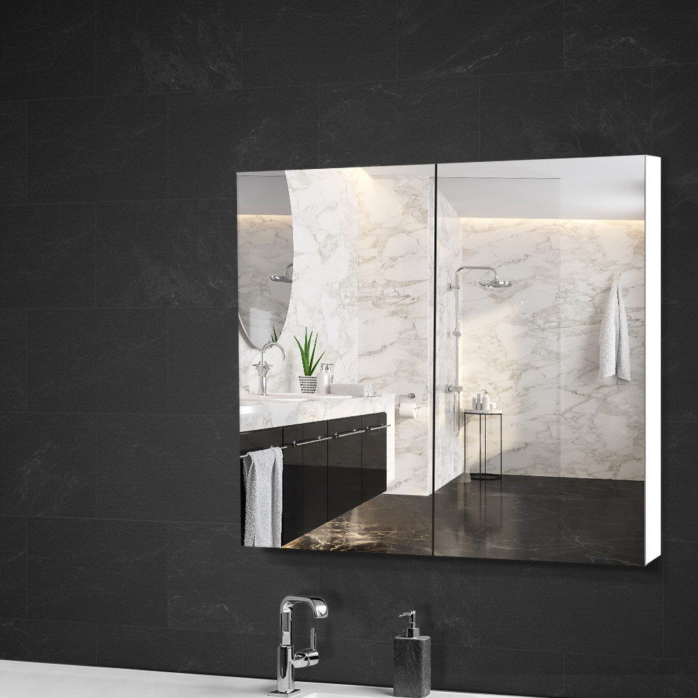 Bathroom Mirror Cabinet 750x720mm White with mirrored doors mounted on black tiled bathroom wall above sink.