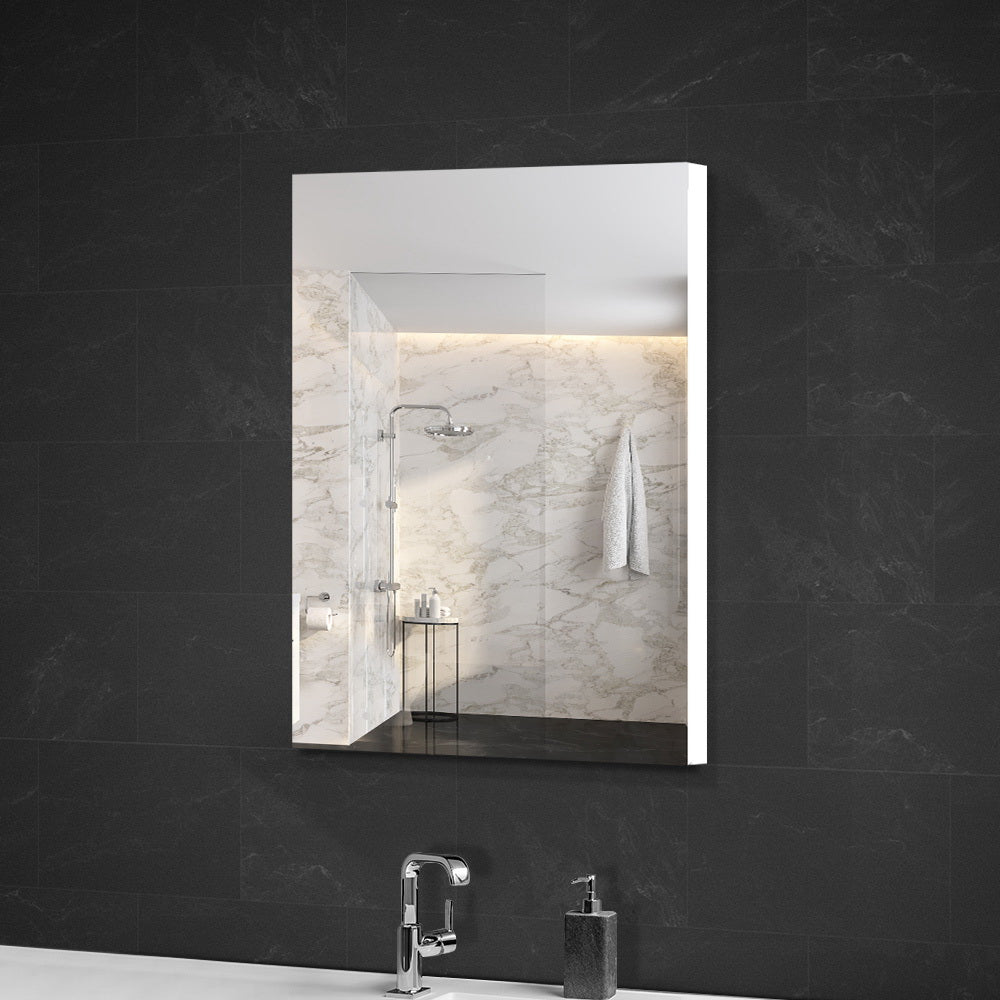 Bathroom Mirror Cabinet 450x720mm White with high gloss finish mounted on dark tiled wall above sink and faucet