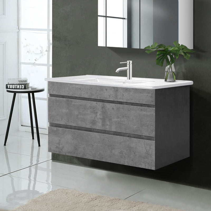 Vanity Unit 915mm with Basin Grey wall-mounted with smooth surface, minimalist faucet, and decorative plant on top