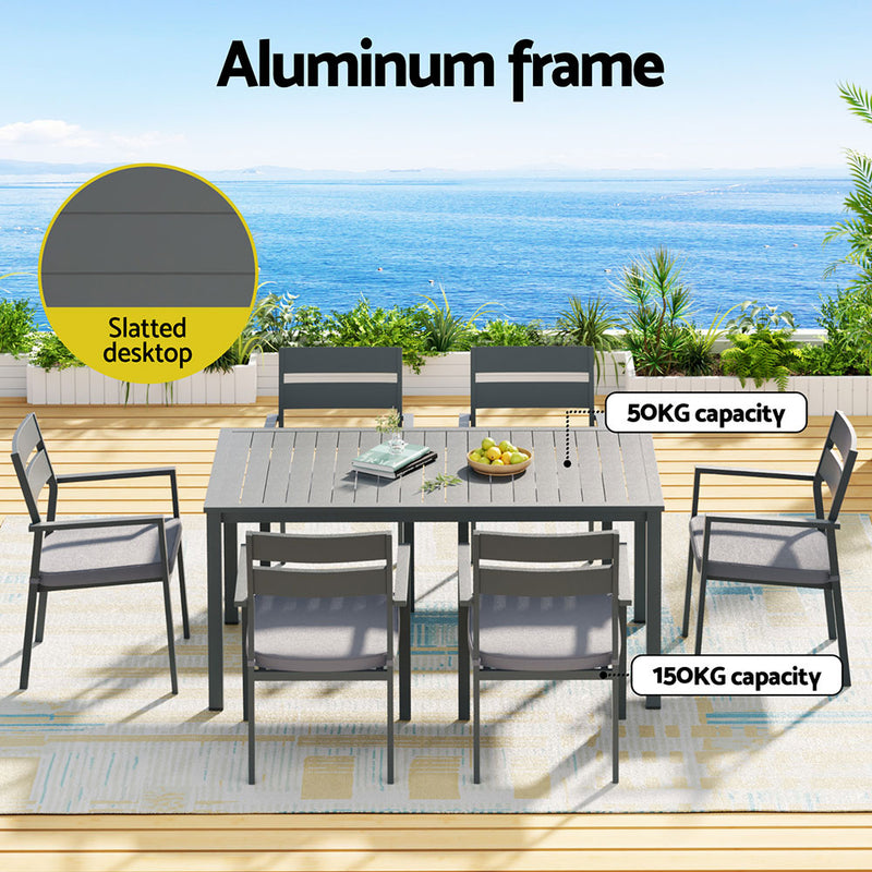Outdoor Dining Set 7 Piece Aluminum Table Chairs Setting Black with slatted tabletop and six matching chairs on patio