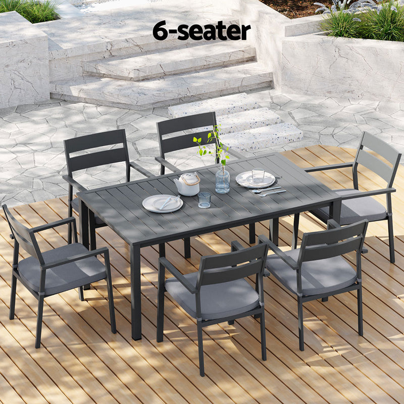Outdoor Dining Set 7 Piece Aluminum Table Chairs Setting Black with six chairs on wooden deck in outdoor patio setting