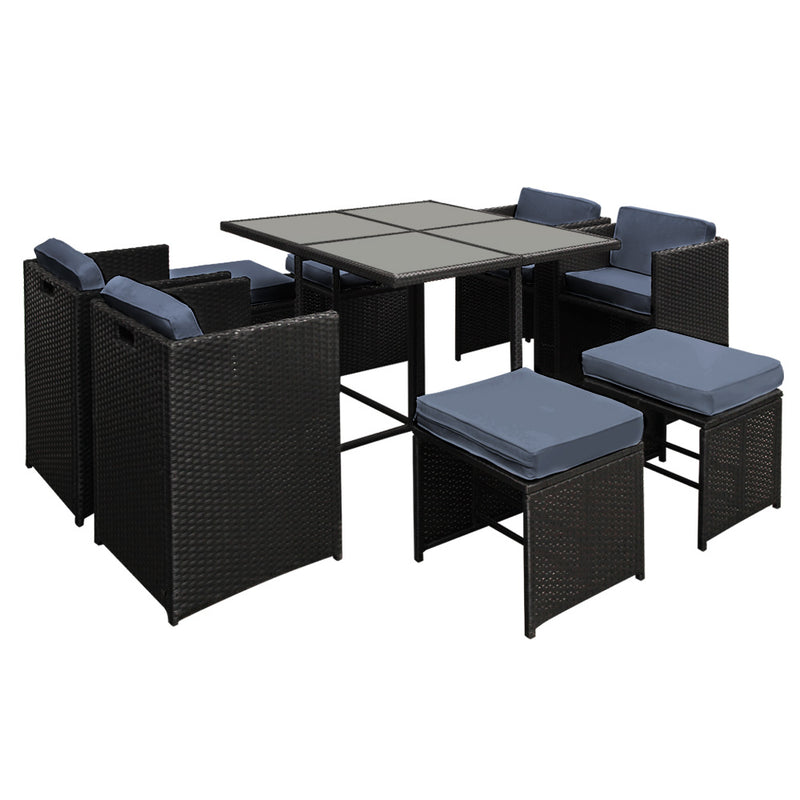 Outdoor Dining Set 9 Piece Wicker Table Chairs Setting Black with powder-coated frame and blue cushions on black background