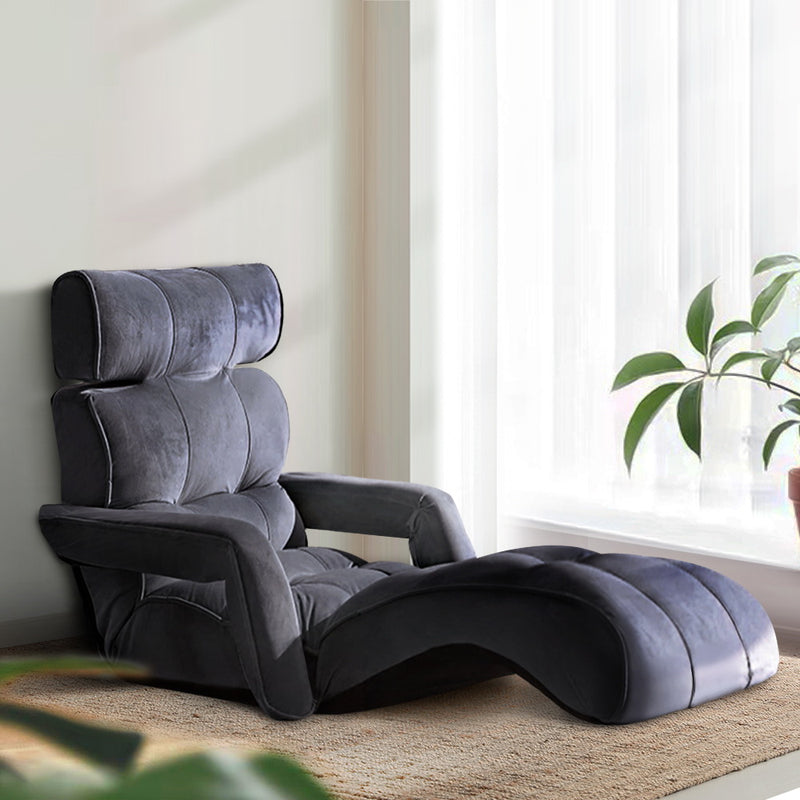 Adjustable Lounger with Arms - Charcoal in plush upholstery, featuring segmented cushioning and ergonomic design by a sunlit window.