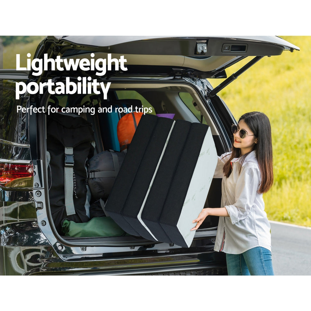 Woman loading Portable Mattress Folding Foldable Foam Floor Bed Tri Fold 180cm into car trunk for camping trip