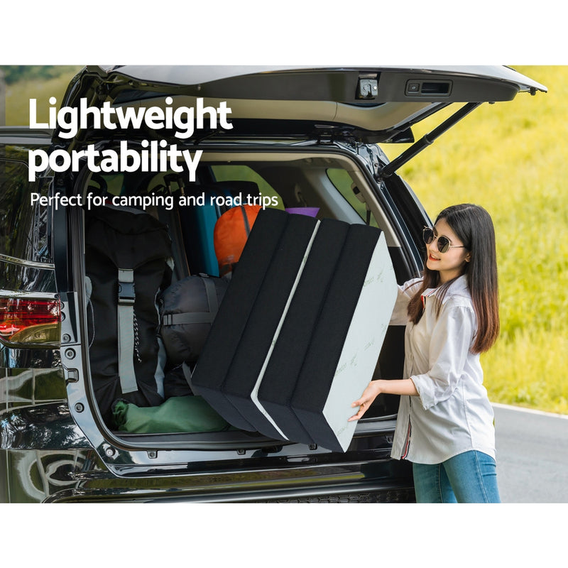 Woman loading Portable Mattress Folding Foldable Foam Floor Bed Tri Fold 180cm into car trunk for camping trip