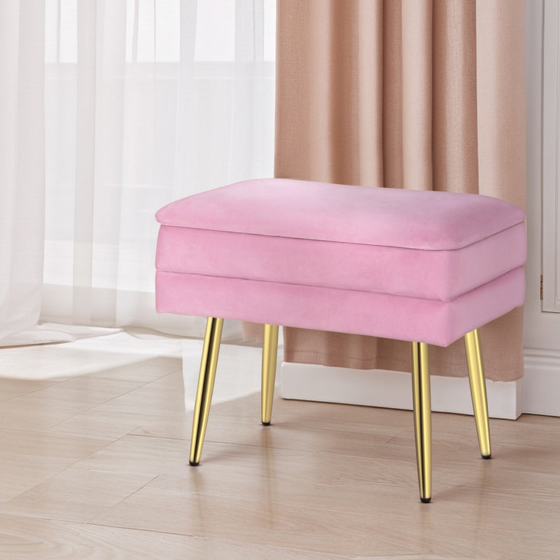 Ottoman Storage Foot Stool Velvet Pink with gold legs, plush velvet upholstery, and storage compartment in bedroom setting