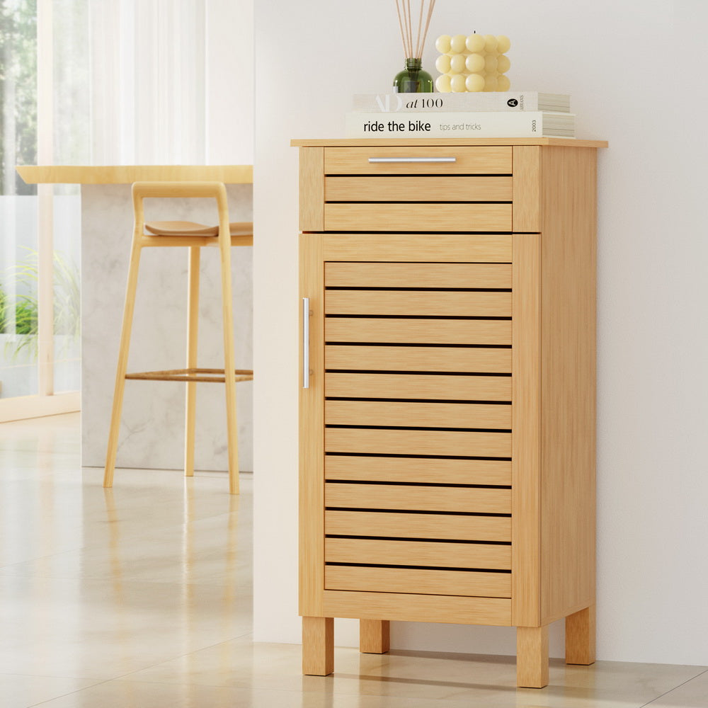 Bathroom Cabinet Storage 90cm wooden JILL with slatted door, single drawer, and chrome handles in bright room setting