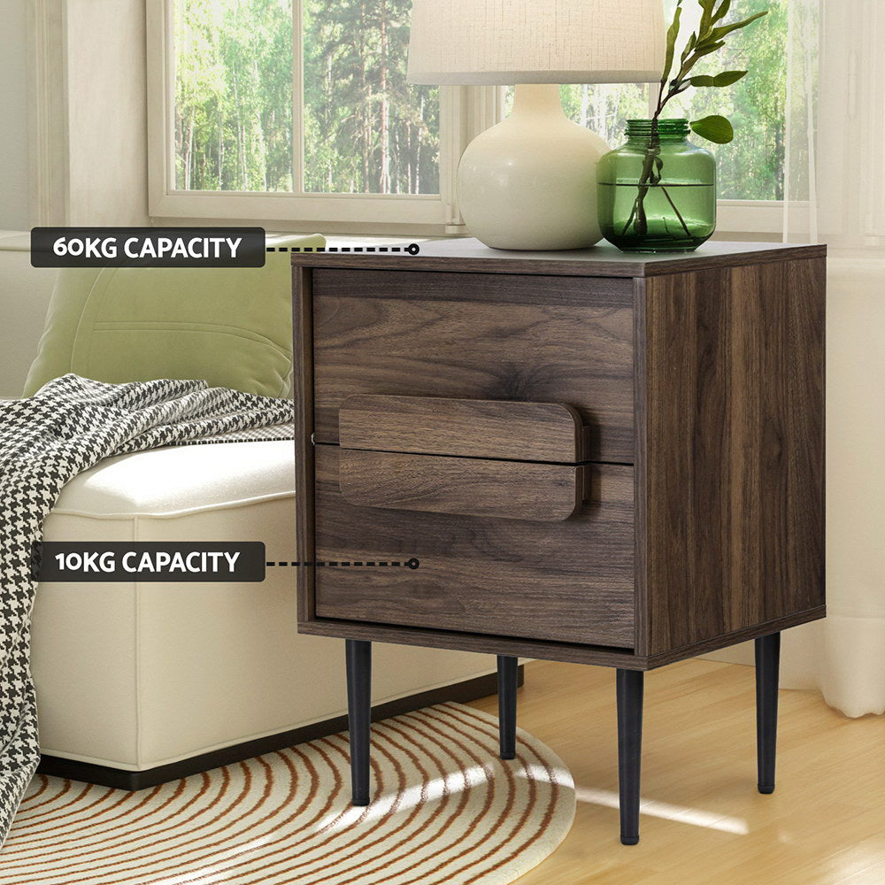 Bedside Table Nightstand 2 Drawers - Walnut with slim black legs, spacious drawers, and decorative lamp and vase on top in bedroom setting