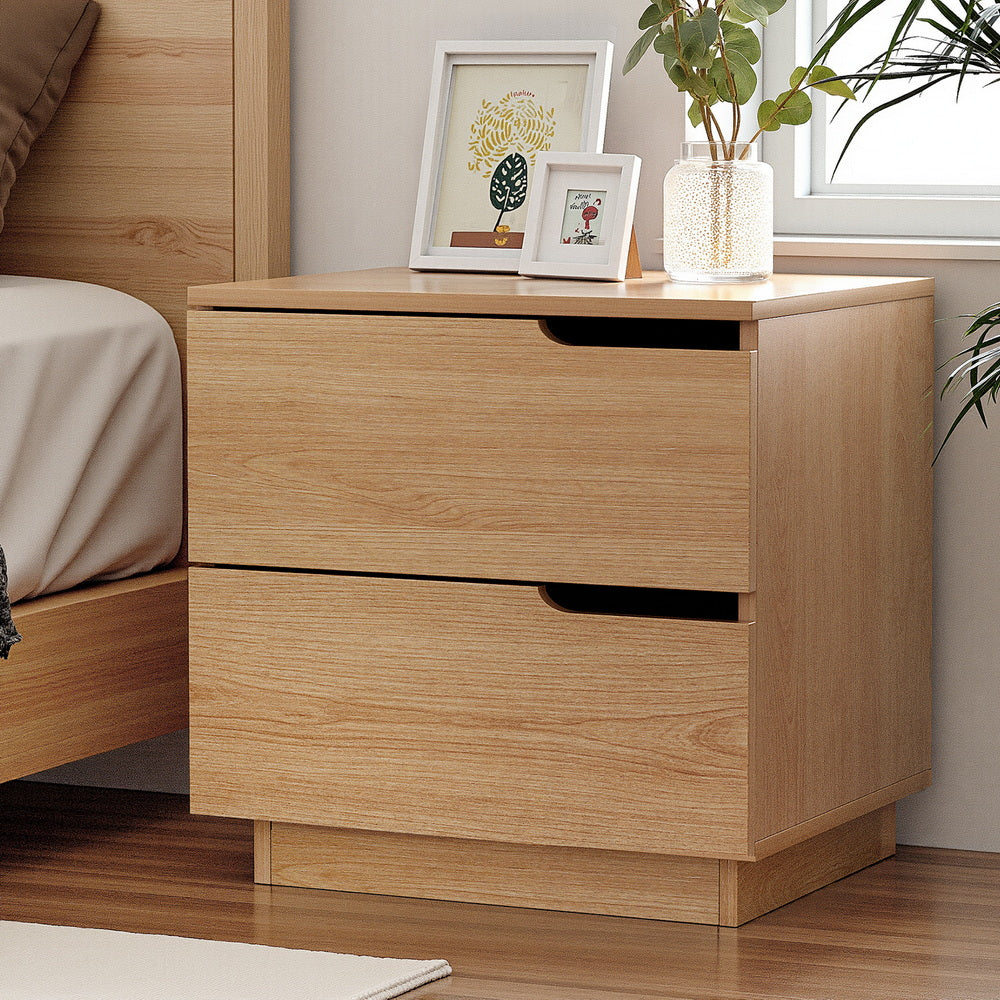 Bedside Table 2 Drawers Nightstand Pine with air gap handles, natural wood finish, shown with decorative frames and plant on top