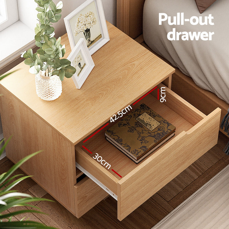 Bedside Table 2 Drawers Nightstand Pine with open pull-out drawer showing wood grain surface and framed photos on top