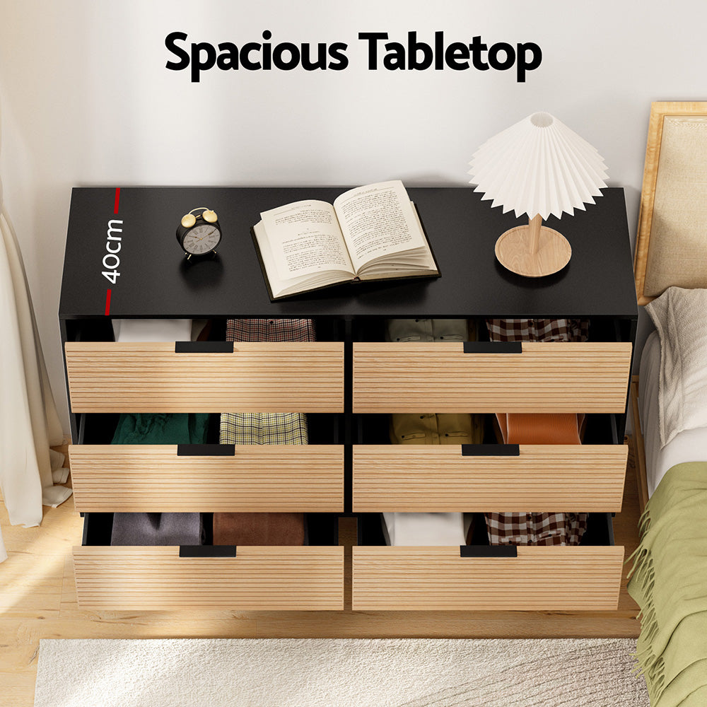 6 Chest of Drawers Dresser Table Black&Pine with six fluted drawers and spacious black tabletop in bedroom setting