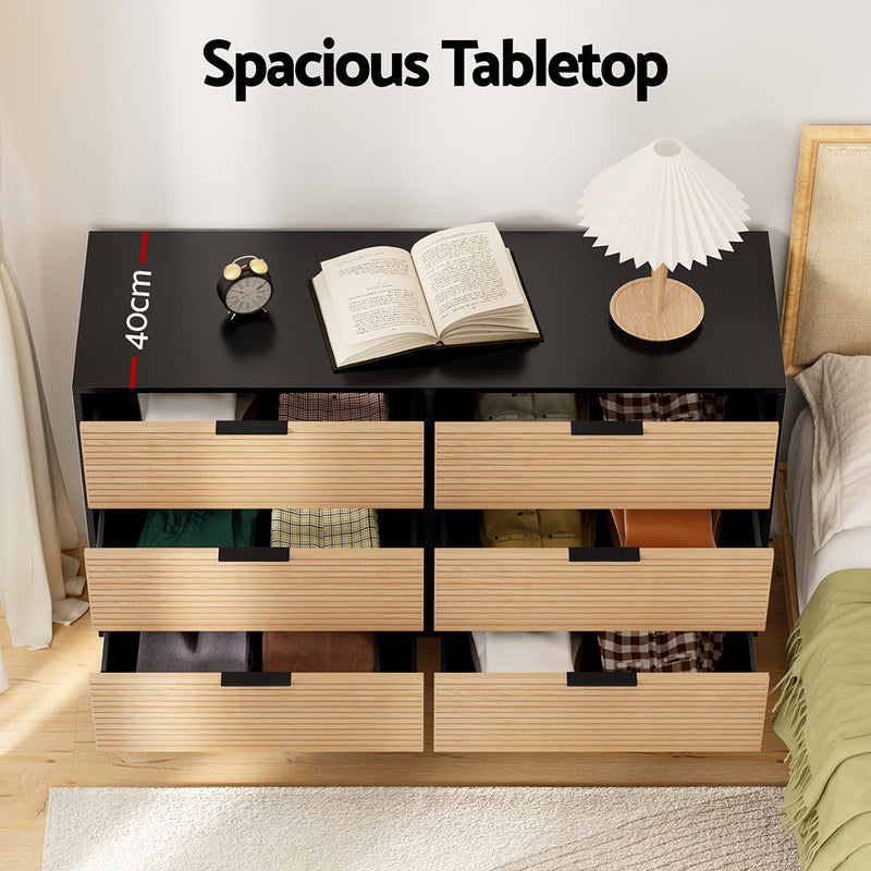 6 Chest of Drawers Dresser Table Black&Pine with six fluted drawers and spacious black tabletop in bedroom setting