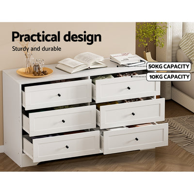 6 Drawer Classic Style Lowboy - White with six spacious drawers, sturdy design, and weight capacity labels on drawers in bedroom setting