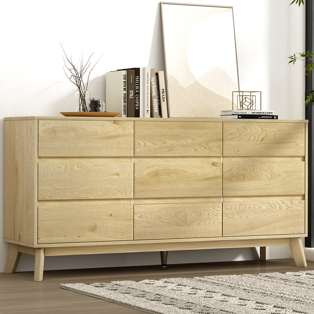9 Drawer Lowboy Cabinet - Pine with smooth glide drawers, styled with books, decor, and framed art in a modern bedroom setting