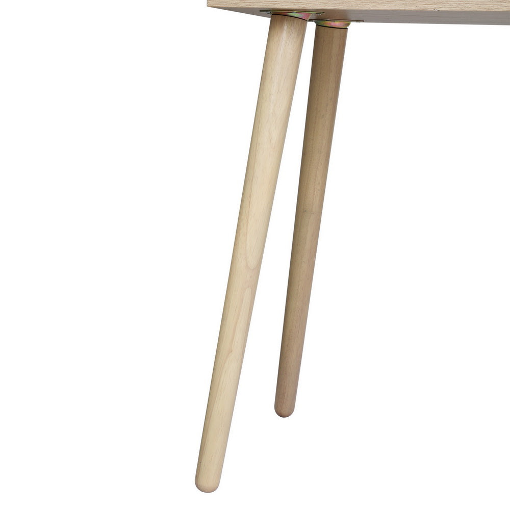 Close-up of solid rubberwood legs supporting the Dressing Table Set Rattan Frances with particle board top and rattan drawers