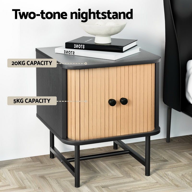 Bedside Table with Sliding Fluted Doors – Black & Pine Finish nightstand with black frame and pine sliding doors on wooden floor