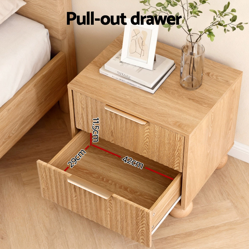 Rattan Bedside Table 2 Drawers Pine with pull-out drawer, metal handles, and decorative items on top by Bedzy bedroom furniture