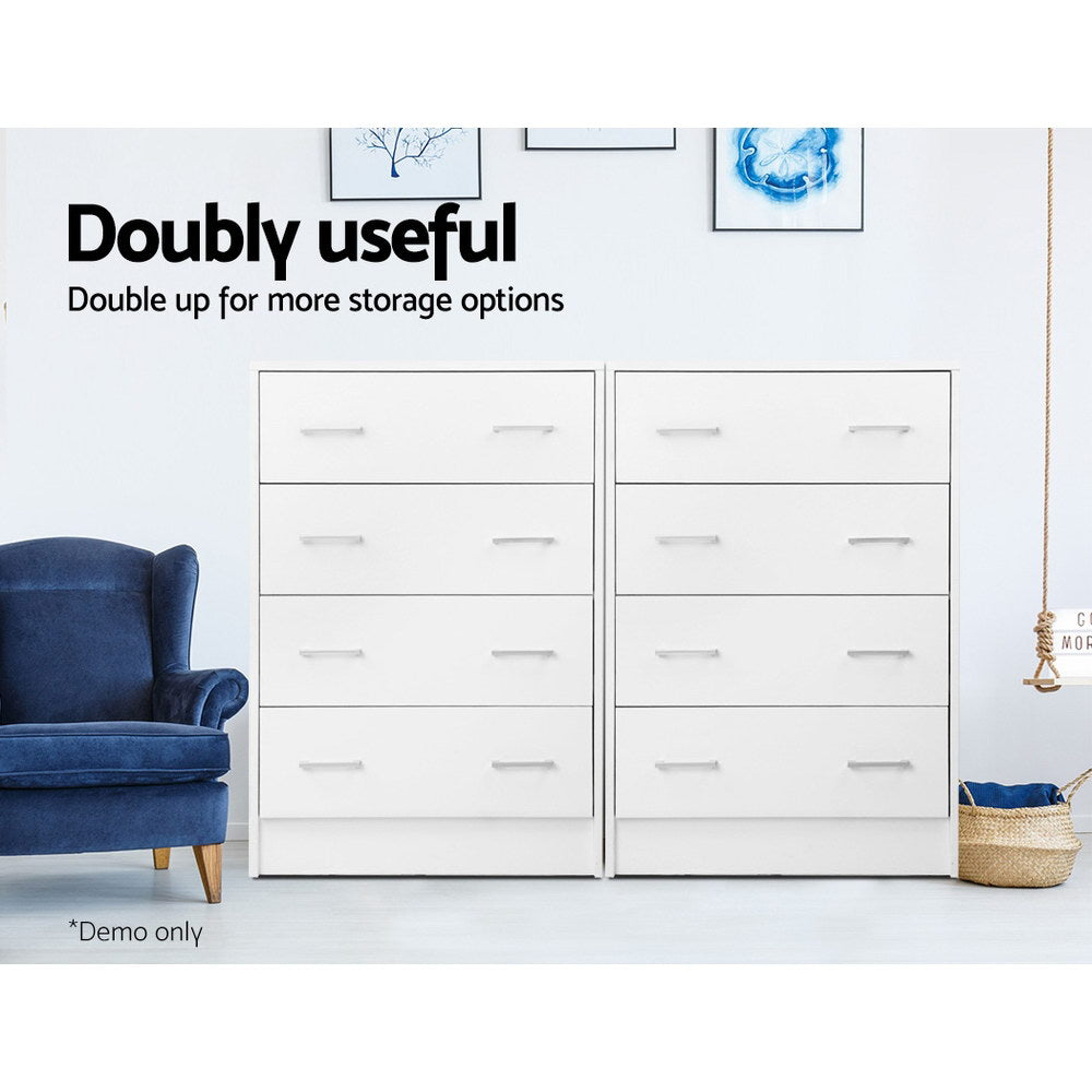 Two Tallboy 4 Drawers Storage Cabinet - White units side by side in a modern bedroom setting with wall art and a blue armchair