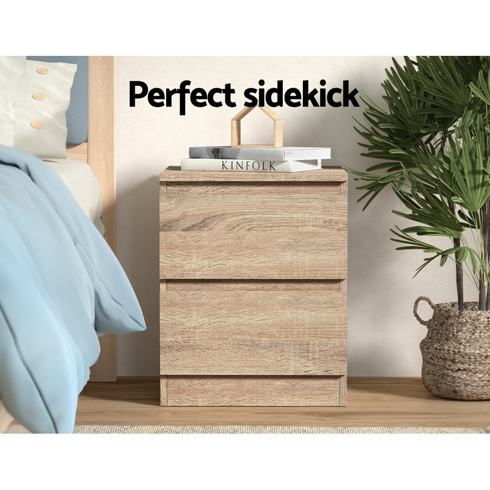 2x Bedside Table 2 Drawers - PEPE Oak with natural oak finish, two deep drawers, styled in bedroom setting with books and plant