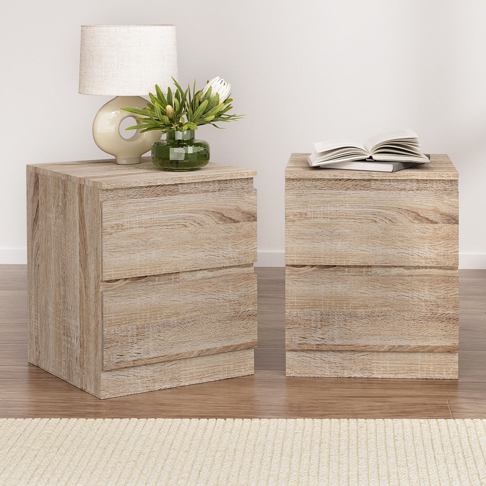 2x Bedside Table 2 Drawers - PEPE Oak twin pack with natural wood finish, two drawers, lamp, and decorative vase on top