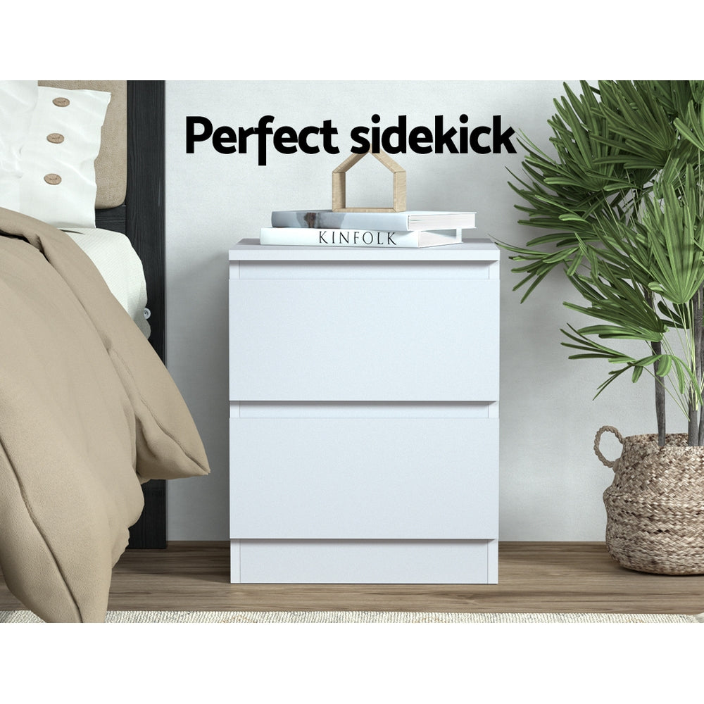 2x Bedside Table 2 Drawers - PEPE White with clean design, placed beside bed with books on top in bedroom setting