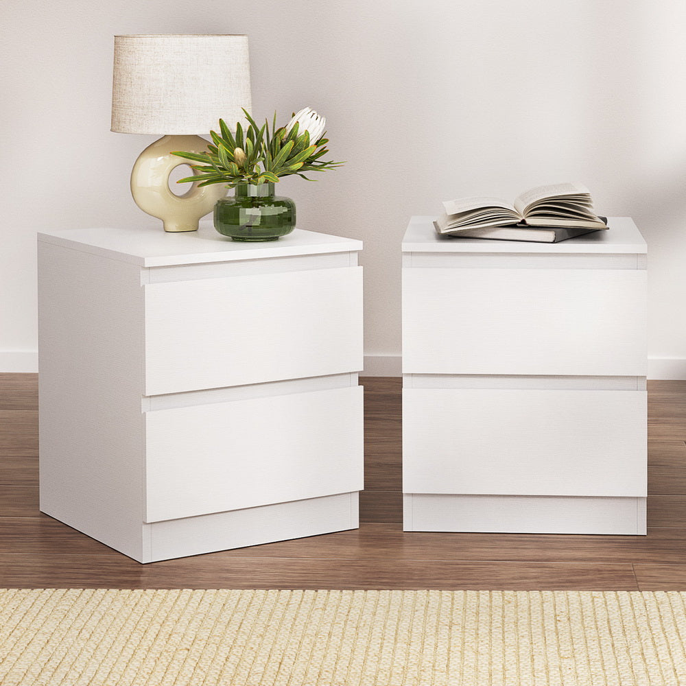 2x Bedside Table 2 Drawers - PEPE White twin pack with modern minimalist design, two drawers, shown with lamp and book.