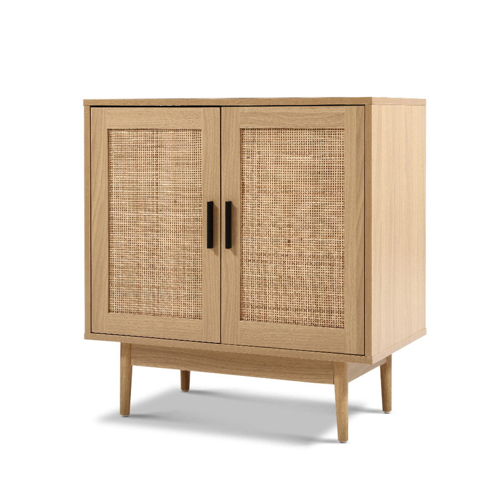 Rattan Sideboard Cabinet in oak finish with woven rattan doors, black handles, and slim wooden legs on white background