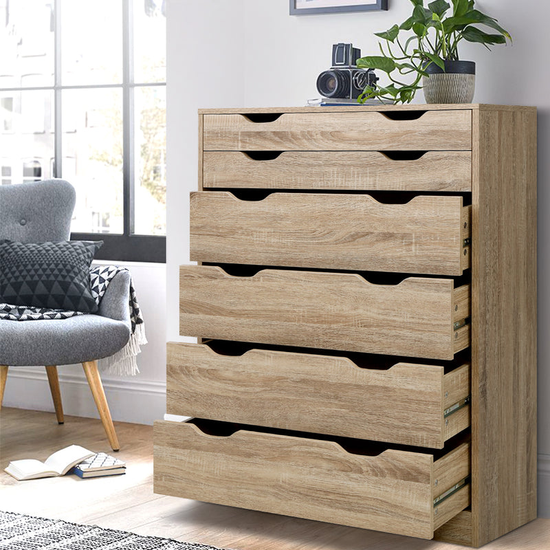 6 Drawer Tallboy Storage Dresser Oak with two shallow and four deep drawers in a bright bedroom setting with decor.